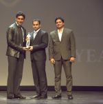 Abhishek Bachchan giving awards to the winner & Girish Karkera (Editor, TopGear Magazine) at _The TopGear India Magazine Awards 2012_.jpg